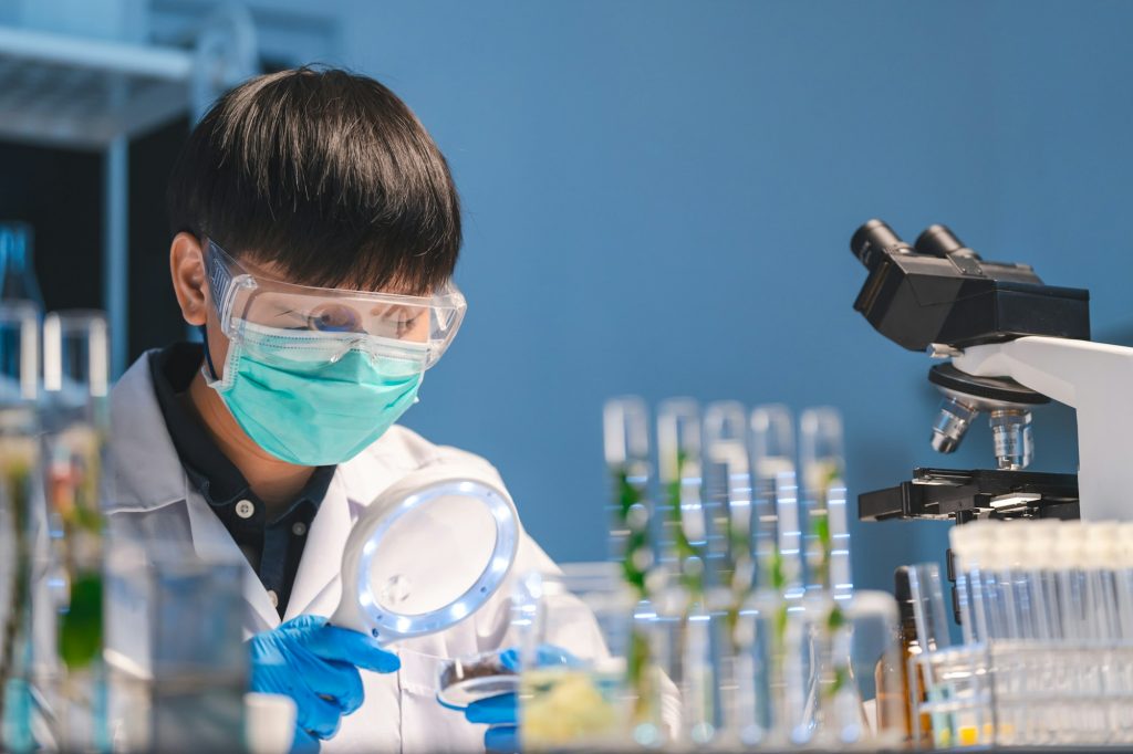 researcher working in laboratory for medicals science research using scientific equipment technology